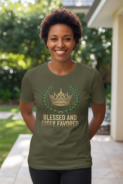 Woman smiling wearing Blessed and Highly Favored t-shirt in military green - front view